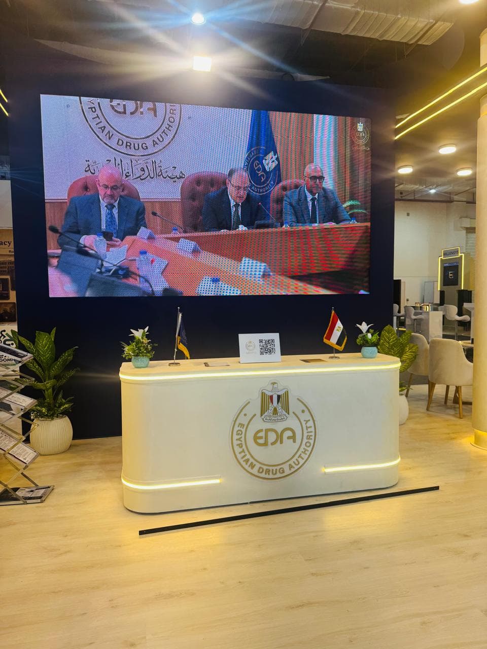 Curved illuminated reception desk, Equal's stand for Egyptian Drug Authority