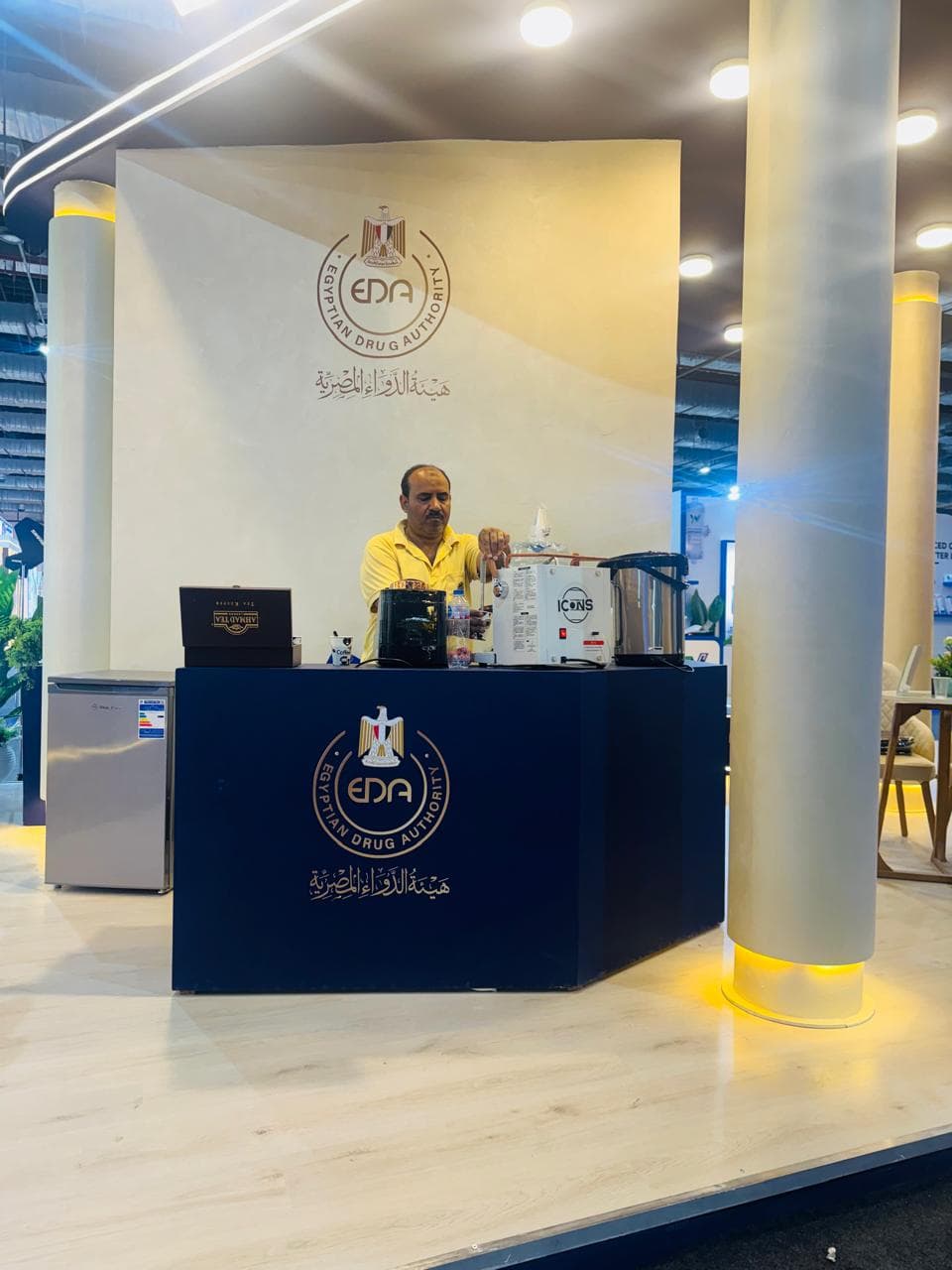 Navy-and-gold pavilion, full elevation, Equal's stand for Egyptian Drug Authority
