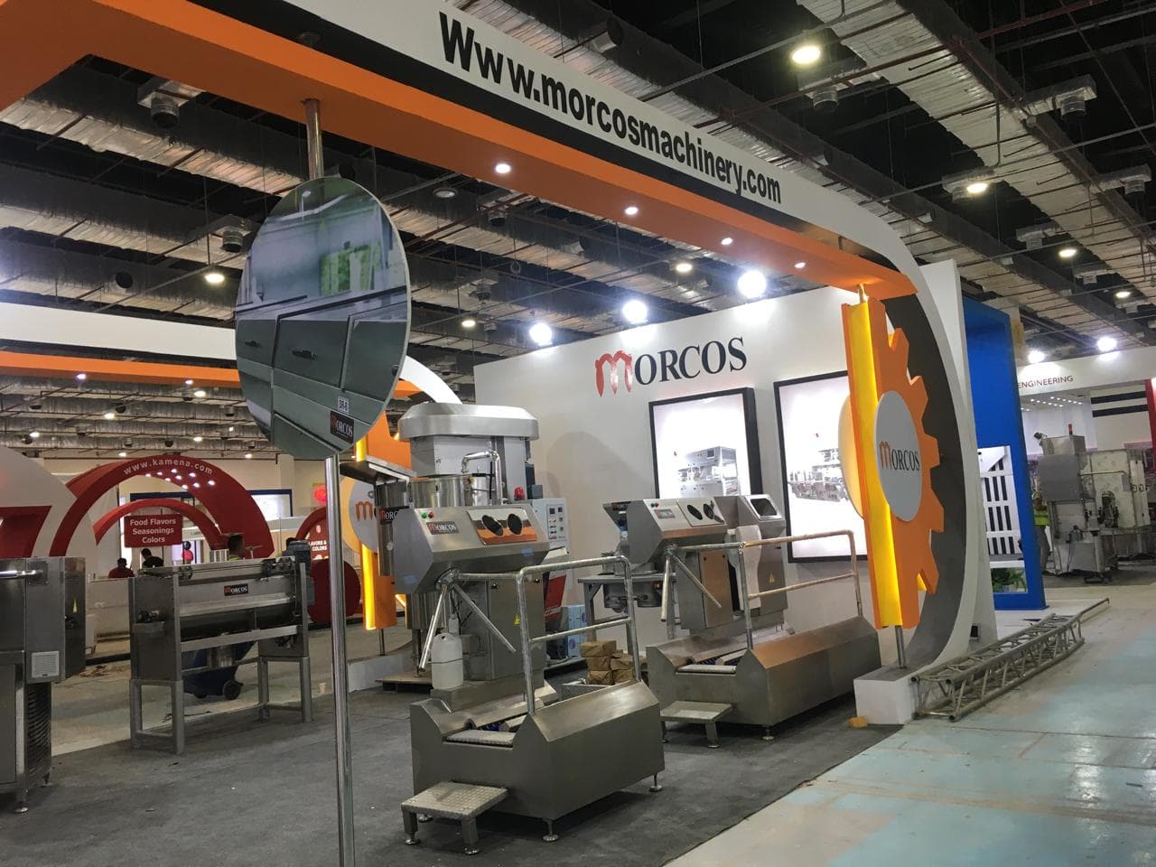 Orange-and-black gear motif signage, Equal's stand for Morcos Machinery